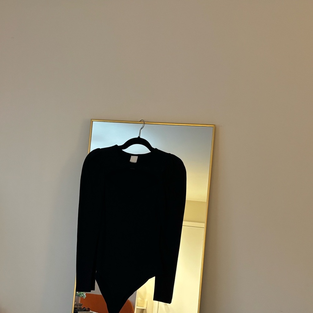 Black body suit with cut out.
